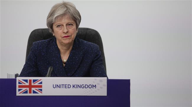 May says Windrush migrants to be compensated