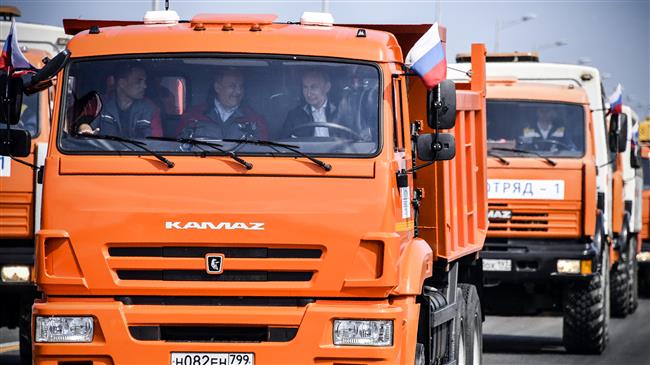 Putin drives truck over bridge linking Russia to Crimea