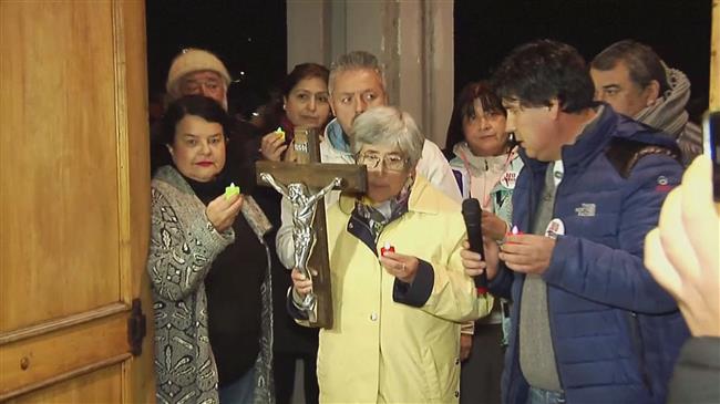 Candle-lit vigil for sexual abuse victims in Chile church