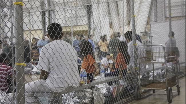 Photos show detained immigrants in cages in US