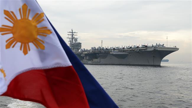 US aircraft carrier docks in Manila amid China tensions