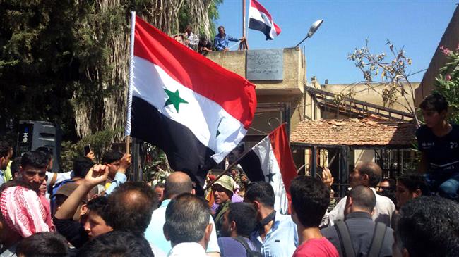 Syrian army hoists national flag in Dara'a city