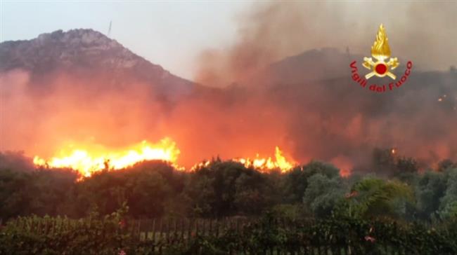 Firefighters battling wildfires in Sicily