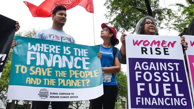 US 'poisoning' UN climate talks amid protests