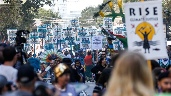 Thousands march in Rise for Climate rally across US 