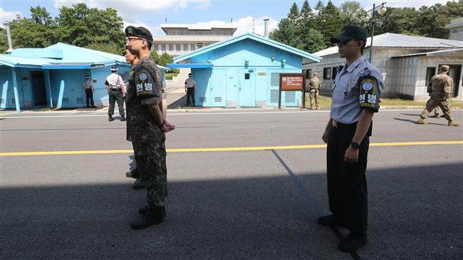 Two Koreas begin removing landmines along border