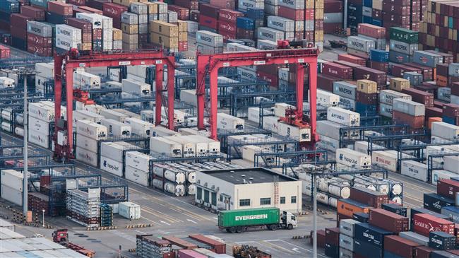 Trump vows 'pain' as China's trade surplus hits record 