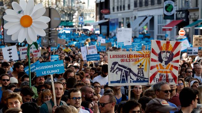 Climate change protesters take to Paris streets