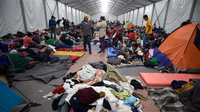 Migrant caravan pauses in Mexico City before heading to US