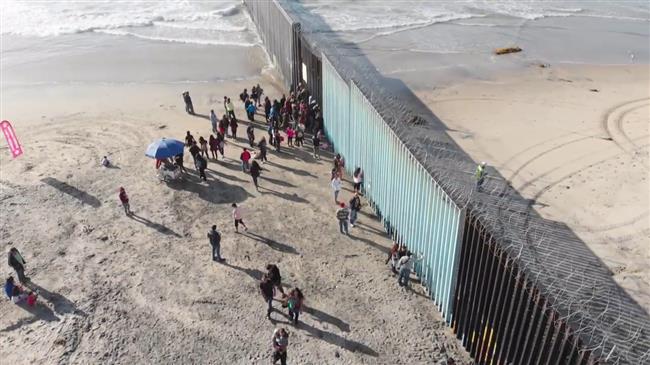 Caravan migrants detained after crossing US border