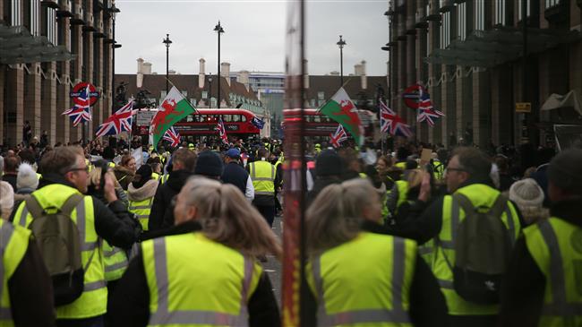 France’s yellow vest protests spread to UK streets