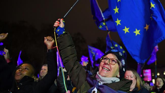 Thousands rally against Brexit as May's deal voted down