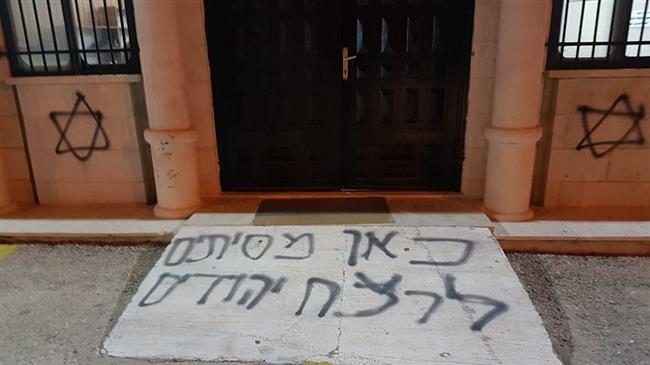 Israeli settlers spray racist slogans on mosque's walls