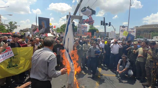 Iranian protesters burn Israeli flags on Quds Day