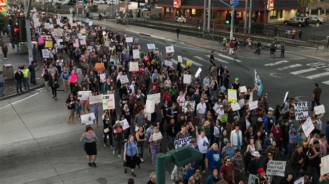 Thousands across US protest against Trump’s treatment of migrants