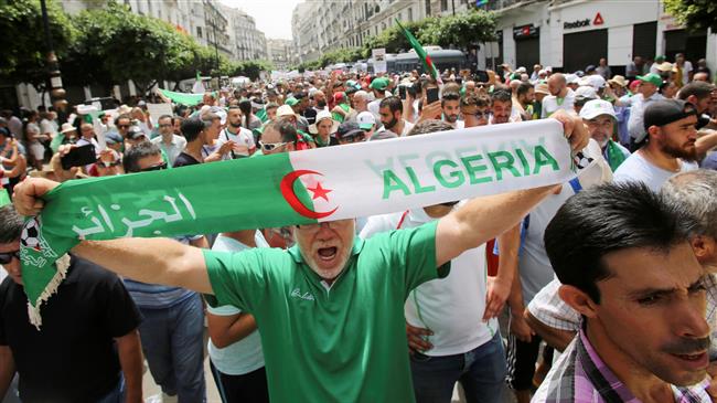 Algerian protesters in mass rally, pledge civil disobedience