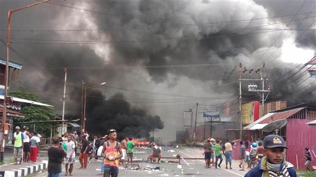 Protesters torch buildings in Indonesia's Papua island