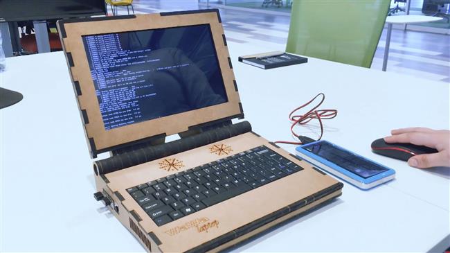 Peruvian family builds low-cost laptop with recycled wood