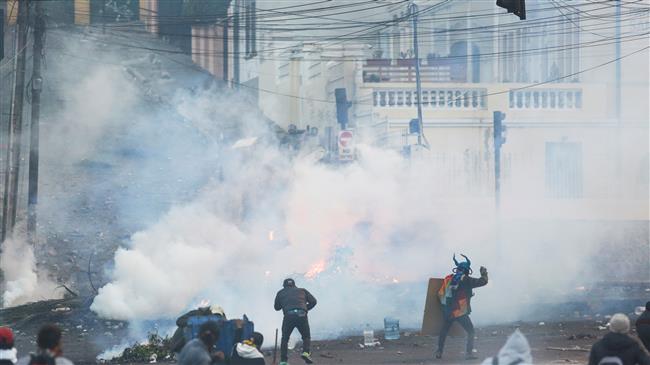Protesters, police clash again in Ecuador capital