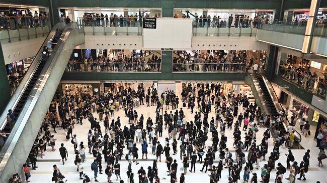 Hong Kong protesters stage flash mob rallies