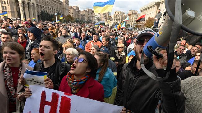 Thousands protest against east Ukraine’s troop pullback 