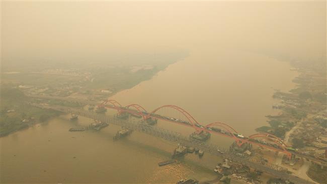 Indonesia shuts schools as haze again clouds the skies