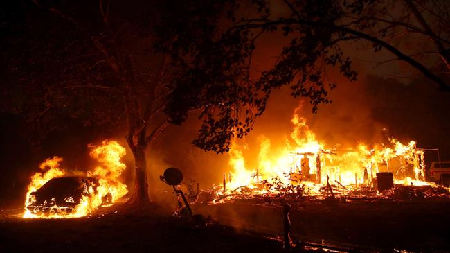 Tens of thousands evacuated as wildfires rage in California