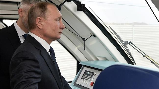 Putin unveils Crimea rail bridge, prompts EU denunciation