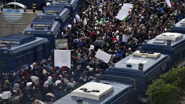 Police crack down on anti-regime protesters in Algerian capital
