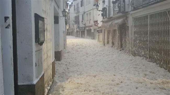 Sea foam floods streets of Spain's Tossa de Mar