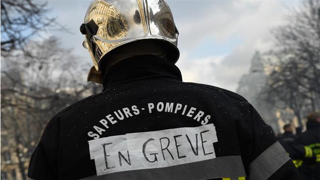 French firemen protest against pension reform in Paris