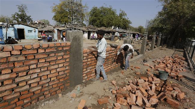 India builds wall to block view of slum during Trump visit