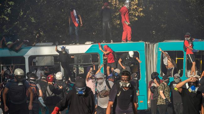 Chilean students clash with police at rally against president