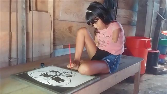 Armless Peruvian girl creates artwork with her feet