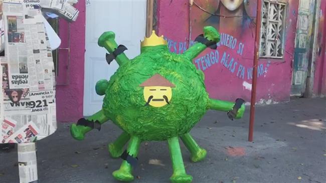 Mexican artisan takes swing at coronavirus pinata 