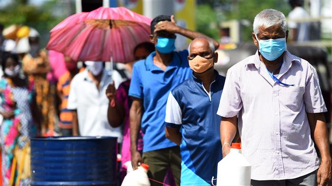 Oil drops to 21-year low with storage filling