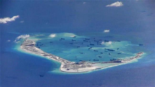 US threatens China with sanctions over South China Sea claims