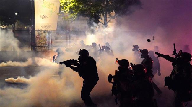 US federal troops fire tear gas on peaceful protesters in Portland