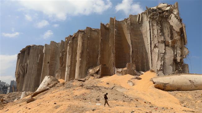 Excavators dig through debris at Beirut blast site