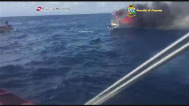 Dramatic video shows rescue operation as refugee boat burns