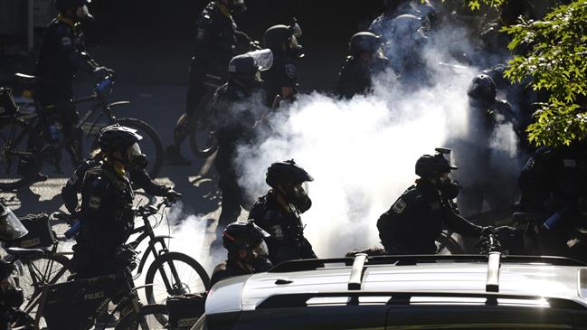 Seattle cop rides bike over protester's head amid anti-racism demos: Video
