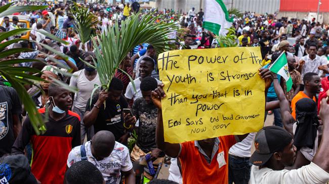 Nigerian protesters paralyze Lagos, govt. imposes curfew