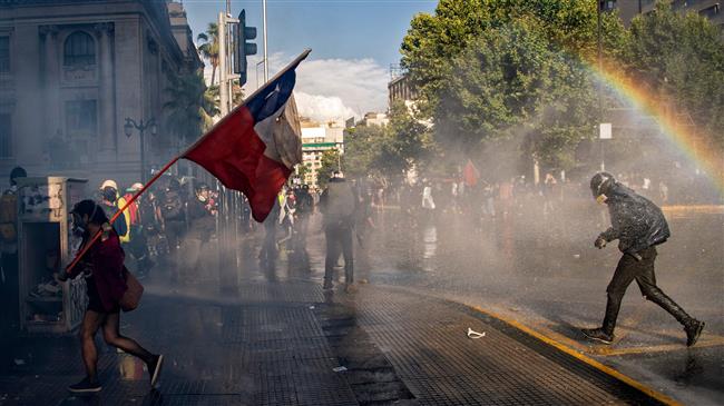 Chile police disperses protesters with water cannons, tear gas