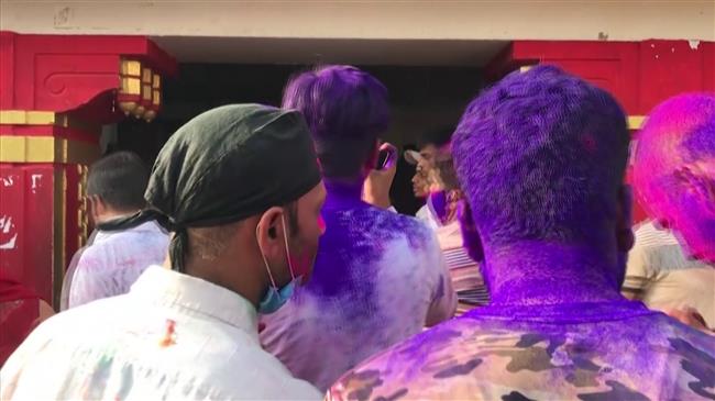 Indians celebrate Holi festival of colors despite virus bans