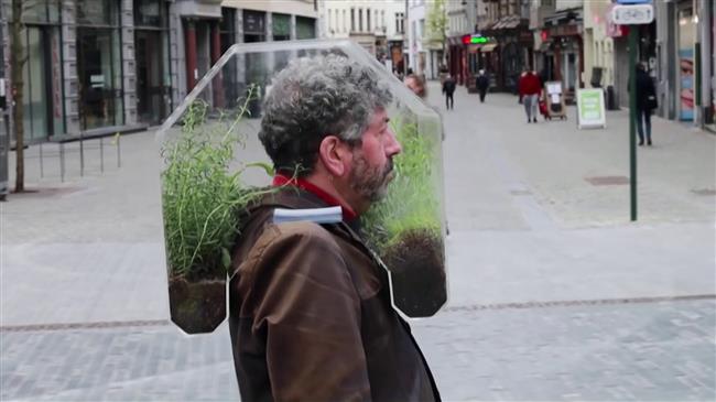 Belgian artist wears 'portable oasis' to fend off COVID-19