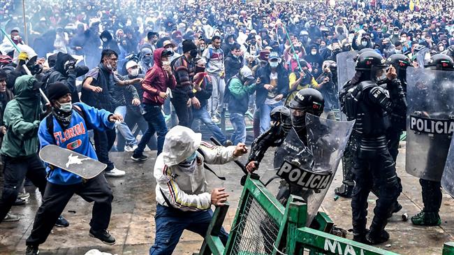 Police, protesters hurl rocks at each other in tense Colombia protest