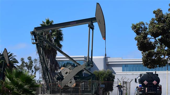 Oil rises over 1% as demand hopes bolster sentiment