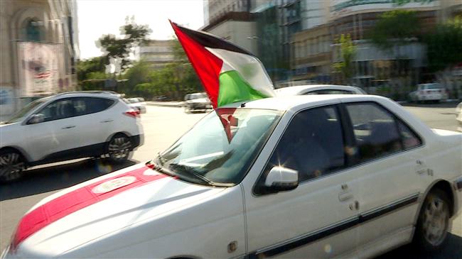 Iranians show solidarity with Palestine in car convoys