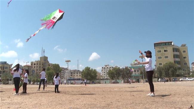 Gaza children fly kites with portraits of kids killed in Israeli strikes